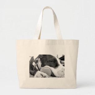 cute sad looking pitbull dog black white with ball large tote bag