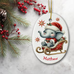 Cute Santa Elephant Sleigh Kids Christmas Ceramic Ornament<br><div class="desc">On the front of this cute kids' Christmas ornament is an adorable baby panda bear sitting in a red and gold sleigh. He wears a red and white Santa hat and santa suit. Red and gold decorative stars are scattered about, and your custom name is at the bottom. The back...</div>