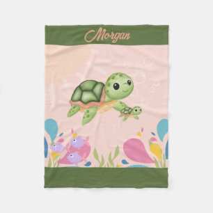 Cute sea turtles in pink ocean, fleece blanket