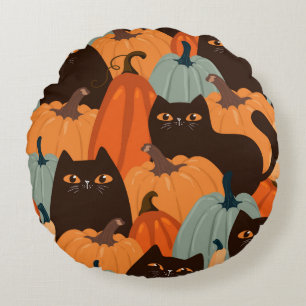Cute seamless pattern with black cats and pumpkins round pillow