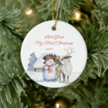 Cute Snowman and Reindeer 1st Christmas Ceramic Ornament<br><div class="desc">Baby 1st Christmas photo ornament with a cute snowman and reindeer in front of a warmly lit cabin in the snow. The template is ready for you to edit the text on the front and add your favourite photo on the back. The photo is displayed in square shape, so if...</div>