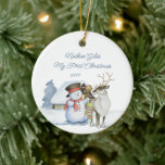 Cute Snowman and Reindeer First Christmas Ceramic Ceramic Ornament<br><div class="desc">Baby first Christmas photo ornament with a cute snowman and reindeer in front of a warmly lit cabin in the snow. The template is ready for you to edit the text on the front and add your favourite photo on the back. The photo is displayed in square shape, so if...</div>