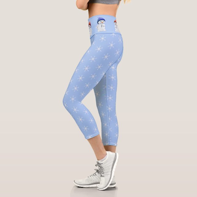 Cute snowman and snowflake pattern on light blue capri leggings (Left)