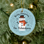 Cute Snowman Christmas Ceramic Ornament<br><div class="desc">A cute Christmas snowman with the words Merry Christmas decorates this ornament. Personalize it with your family name. A fun accent for the Christmas holiday season. Designed for you by Blackberry Boulevard.</div>