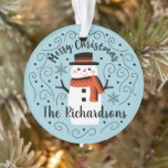 Cute Snowman Christmas Ceramic Ornament<br><div class="desc">A cute Christmas snowman with the words Merry Christmas decorates this ornament. Personalize it with your family name. A fun accent for the Christmas holiday season. Designed for you by Blackberry Boulevard.</div>
