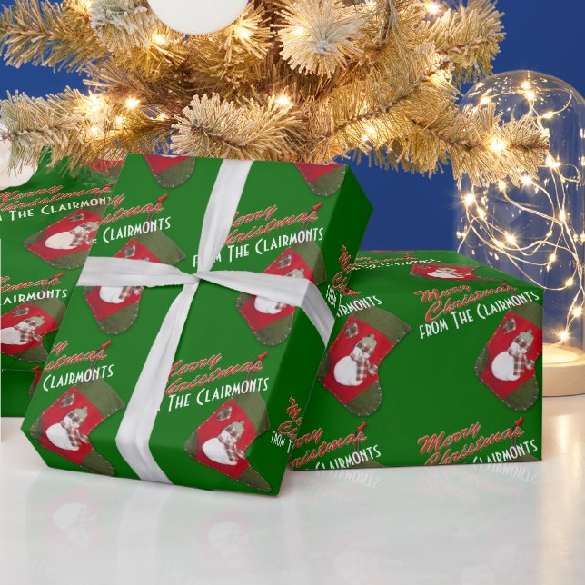 Cute Snowman on Christmas Stocking Over Green Wrapping Paper (Holidays)
