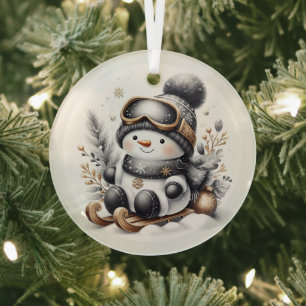 Cute snowman sledding glass ornament