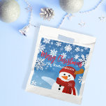 Cute Snowman Winter Wonderland Merry Christmas Favour Bag<br><div class="desc">Experience the joy of giving with our personalized Christmas favour bag. This charming favour bag, adorned with a jovial snowman set against a serene blue backdrop, captures the magic of a white Christmas. Each snowflake surrounding the snowman adds a touch of winter wonder, making it an enchanting sight to behold....</div>