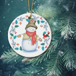 Cute Snowman with Bird Wreath Christmas Ceramic Ornament<br><div class="desc">The front of this cute Holiday ornament has a happy snowman all dressed up in his top hat, winter scarf, jacket, and mittens. With a big smile on his face, he is looking at a little red cardinal bird which is perched in a blue leaf and red berry wreath. The...</div>