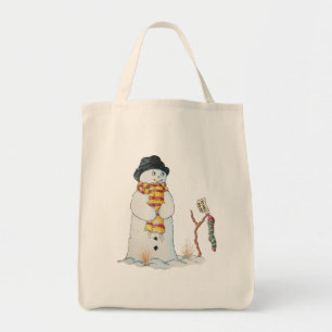 Cute snowman with Christmas stocking in the snow Tote Bag
