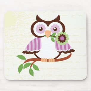 Cute spring owl holding a flower in her beak mouse pad