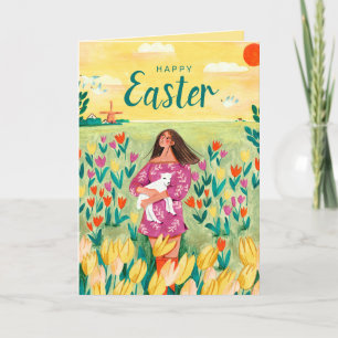 Cute spring woman in tulip field Easter Holiday Card
