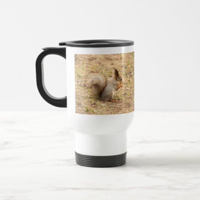 Cute squirrel eats a nut photo travel mug (Left)