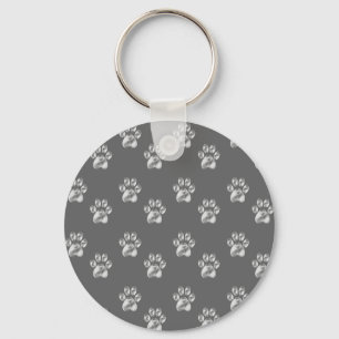 Cute stylish paw pattern on dark grey keychain