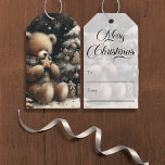Cute Teddy Bear Christmas Gift Tags<br><div class="desc">Enjoy this adorable gift tag for your holiday parties. This "Cute Teddy Bear Christmas" design sits near a small, decorated, snow covered Christmas tree with a gold star and baubles. He wears a plaid scarf, and in the dark black distance you can see snowflakes falling. "Merry Christmas" script on back...</div>