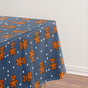 Cute teddy bear on polka dot tablecloth