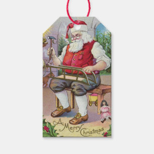 Cute Vintage Santa Making a Sled Gift Tag