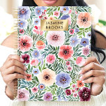 Cute Watercolor Floral Custom Name Planner<br><div class="desc">Stay organized in style with this beautiful floral planner! Featuring a vibrant watercolor design in shades of pink, purple, and blue, this planner is perfect for keeping track of appointments, to-dos, and important dates. The gold nameplate adds a touch of elegance and personalization, making it a unique and thoughtful gift....</div>