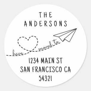 Cute We Have Moved Modern Heart Paper Plane Script Classic Round Sticker