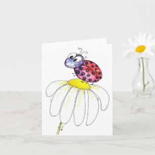 Cute Whimsical Red Ladybug on a White Flower Card