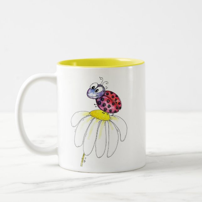 Cute Whimsical Red Ladybug on a White Flower Two-Tone Coffee Mug (Left)
