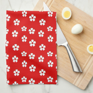 Cute white flowers on red kitchen towel