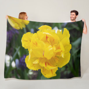 Cute yellow tulips in the garden fleece blanket