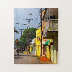 Cycling down Queen Street, Speightstown, Barbados Jigsaw Puzzle