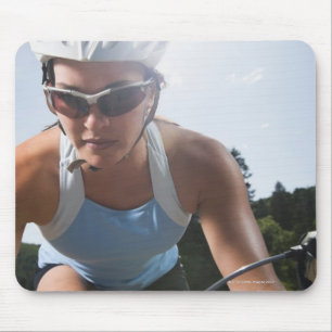Cyclist on mountain road mouse pad