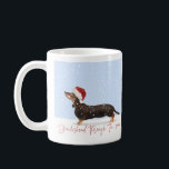 DACHSHUND THROUGH THE SNOW Cute Christmas Coffee Mug<br><div class="desc">Who wouldn't love this adorable holiday mug?!! Featuring a cute black & tan Dachshund out in the snow,  wearing a Santa hat,  with "Dachshund Through the Snow" written across in festive red hand lettered calligraphy. Copyright Tuxi's Mom Designs,  all rights reserved.</div>