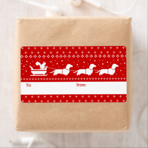 Dachshunds Sleigh de Noël avec un cadeau d'écureui