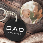 Dad est year father's day new baby photo black keychain<br><div class="desc">Keychain featuring the text "Dad" in a modern font with the est year below. On the back is a customizable photo template. Default colours are black and white but all colours can be customized in the design tool.</div>