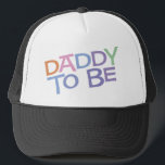 Daddy to Be Trucker Hat<br><div class="desc">Daddy to Be Maternity T-Shirts & Apparel -- This colourful maternity design reads "Daddy to be" in a rainbow coloured, retro font.</div>