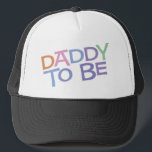 Daddy to Be Trucker Hat<br><div class="desc">Daddy to Be Maternity T-Shirts & Apparel -- This colourful maternity design reads "Daddy to be" in a rainbow coloured,  retro font.</div>