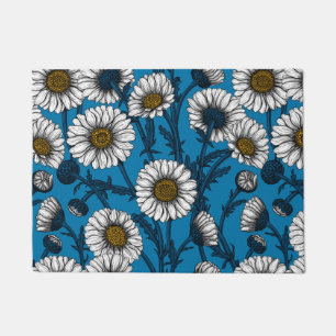 Daisies on blue doormat