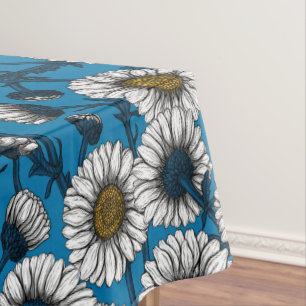 Daisies on blue tablecloth