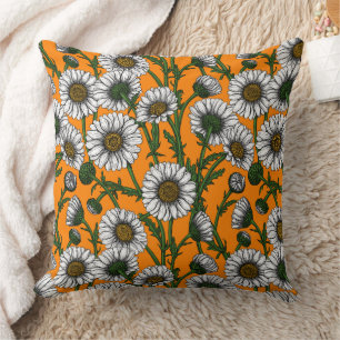 Daisies on orange throw pillow