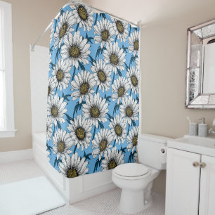 Daisies, wild flowers on blue