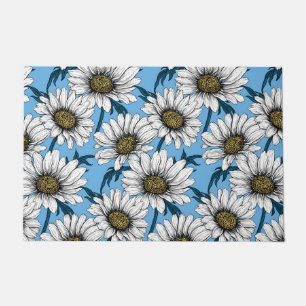 Daisies, wild flowers on blue doormat