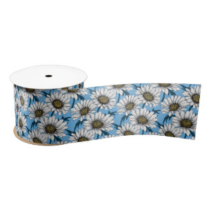 Daisies, wild flowers on blue satin ribbon