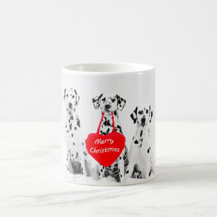 Dalmates souhaitant la tasse de Joyeux Noël