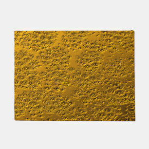 Damaged gold metal doormat