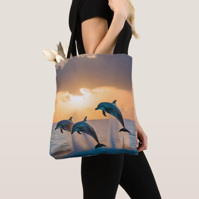 Dancing in the Dusk: Three Dolphins Leaping  Tote Bag (Close Up)