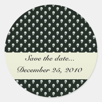 Dangerous white skull on retro black surface classic round sticker