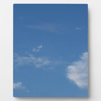dark blue sky white clouds plaque