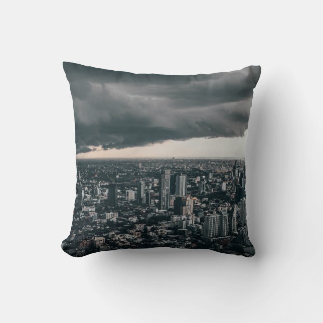DARK CLOUD ABOVE CITY BUILDINGS THROW PILLOW (Front)