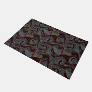 Dark coloured carved spiral parts and glow strokes doormat