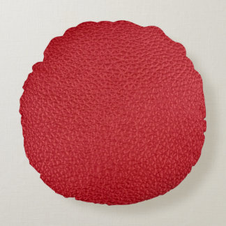 Dark red artificial leatherette closeup. round pillow