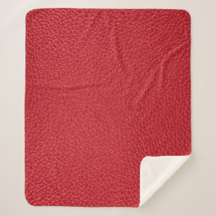 Dark red artificial leatherette closeup. sherpa blanket