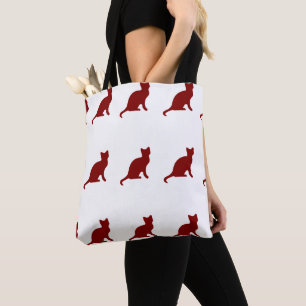 Dark red cat on white tote bag